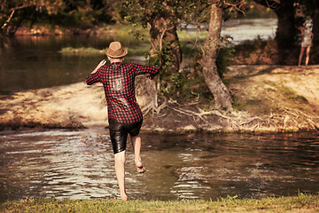 Image showing man jumping into the river