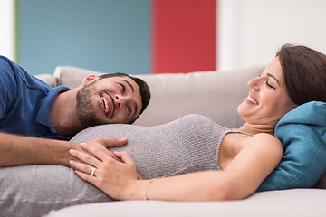 Image showing future dad listening the belly of his pregnant wife