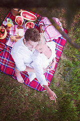 Image showing top view of couple enjoying picnic time