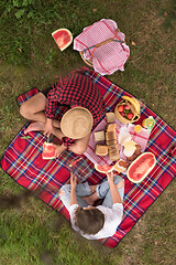 Image showing top view of couple enjoying picnic time