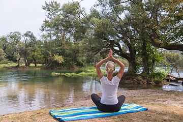 Image showing woman meditating and doing yoga exercise