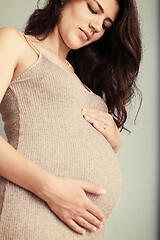 Image showing Portrait of pregnant woman over blue background