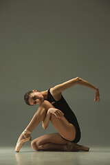 Image showing Young graceful female ballet dancer dancing in mixed light