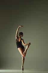 Image showing Young graceful female ballet dancer dancing in mixed light