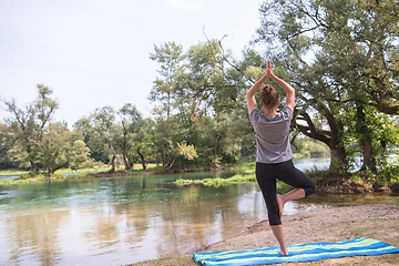 Image showing woman meditating and doing yoga exercise