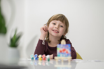 Image showing little girl painting on canvas