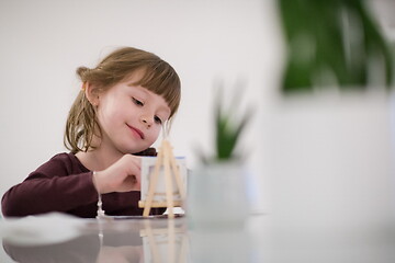 Image showing little girl painting on canvas