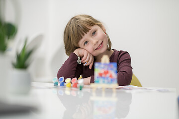 Image showing little girl painting on canvas