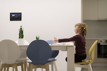 Image showing little girl painting on canvas