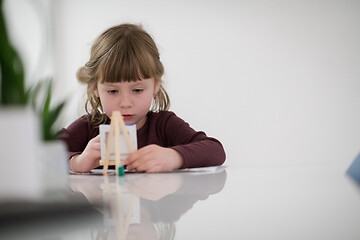 Image showing little girl painting on canvas