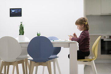 Image showing little girl painting on canvas