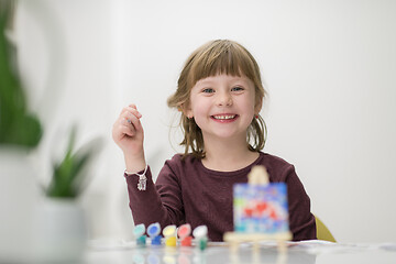 Image showing little girl painting on canvas