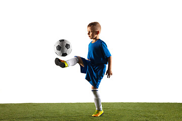 Image showing Young boy as a soccer or football player on white studio background