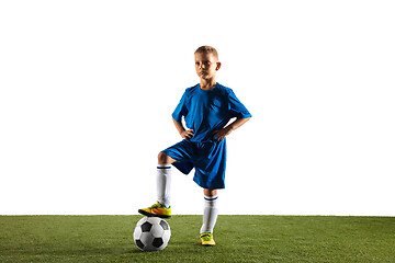 Image showing Young boy as a soccer or football player on white studio background