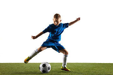 Image showing Young boy as a soccer or football player on white studio background