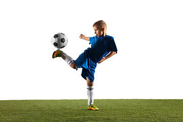 Image showing Young boy as a soccer or football player on white studio background