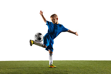 Image showing Young boy as a soccer or football player on white studio background