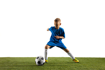 Image showing Young boy as a soccer or football player on white studio background