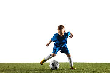 Image showing Young boy as a soccer or football player on white studio background