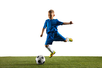 Image showing Young boy as a soccer or football player on white studio background