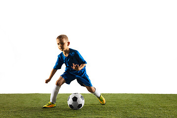 Image showing Young boy as a soccer or football player on white studio background