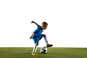 Image showing Young boy as a soccer or football player on white studio background