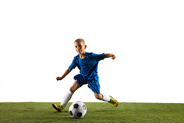 Image showing Young boy as a soccer or football player on white studio background