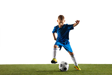 Image showing Young boy as a soccer or football player on white studio background