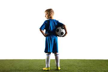 Image showing Young boy as a soccer or football player on white studio background