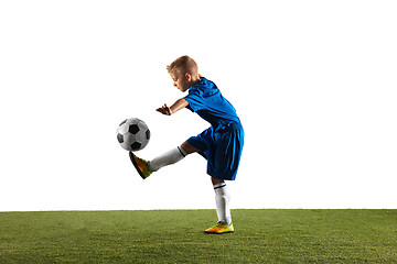 Image showing Young boy as a soccer or football player on white studio background