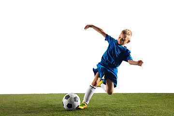 Image showing Young boy as a soccer or football player on white studio background