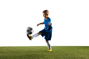 Image showing Young boy as a soccer or football player on white studio background