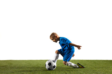 Image showing Young boy as a soccer or football player on white studio background