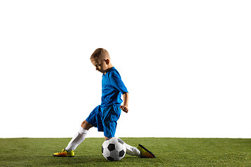 Image showing Young boy as a soccer or football player on white studio background