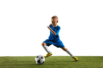 Image showing Young boy as a soccer or football player on white studio background