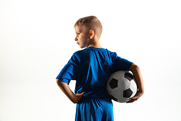 Image showing Young boy as a soccer or football player on white studio background