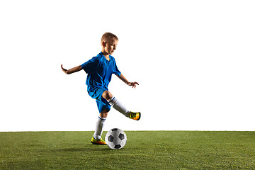 Image showing Young boy as a soccer or football player on white studio background