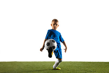 Image showing Young boy as a soccer or football player on white studio background