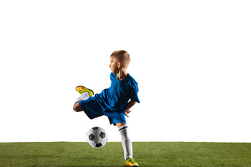 Image showing Young boy as a soccer or football player on white studio background