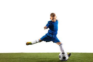 Image showing Young boy as a soccer or football player on white studio background