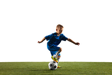 Image showing Young boy as a soccer or football player on white studio background