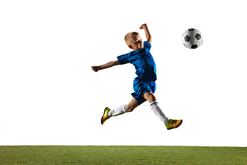 Image showing Young boy as a soccer or football player on white studio background