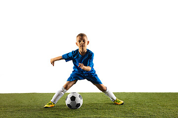 Image showing Young boy as a soccer or football player on white studio background