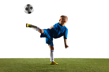 Image showing Young boy as a soccer or football player on white studio background