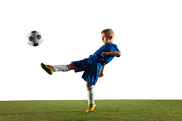 Image showing Young boy as a soccer or football player on white studio background