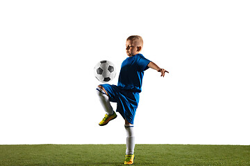 Image showing Young boy as a soccer or football player on white studio background