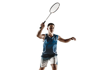 Image showing Little boy playing badminton isolated on white studio background