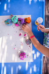 Image showing kid hands Playing with Colorful Clay