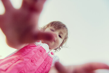 Image showing little girl spending time at backyard