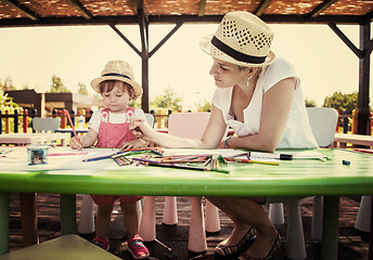 Image showing mom and little daughter drawing a colorful pictures